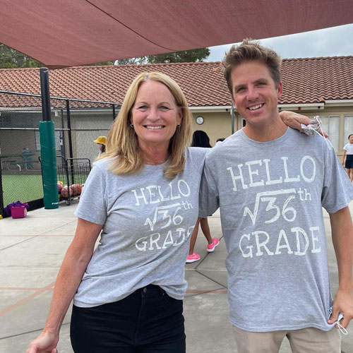 Two smiling Del Mar Pines teachers wearing matching gray t-shirts