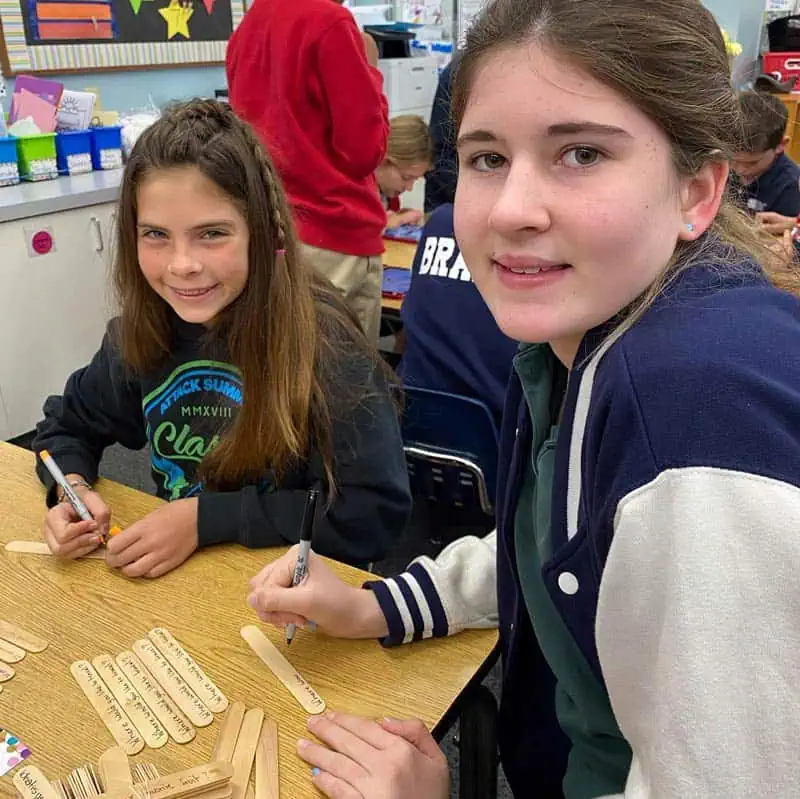 dmp 6th grade students working at their table